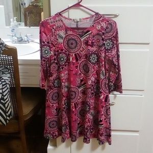 Very cute Rose Mary multi colored design dress with pockets.